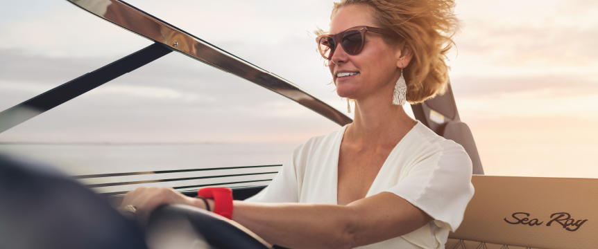 Woman driving boat